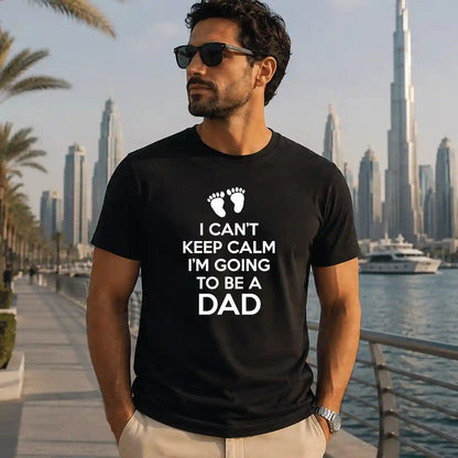 Man wearing black "I'm Going to Be a Dad" printed t-shirt, pregnancy announcement shirt for expecting fathers, Father's Day gift, Dubai UAE lifestyle.