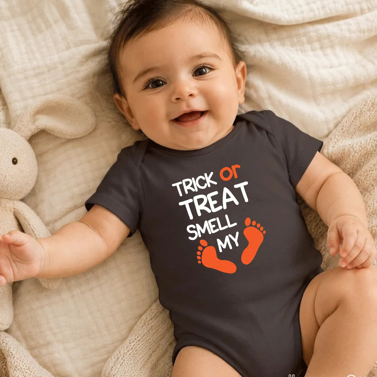 Close-up of Halloween Trick or Treat baby bodysuit, soft breathable cotton outfit for babies, perfect for Halloween celebrations and gifts UAE