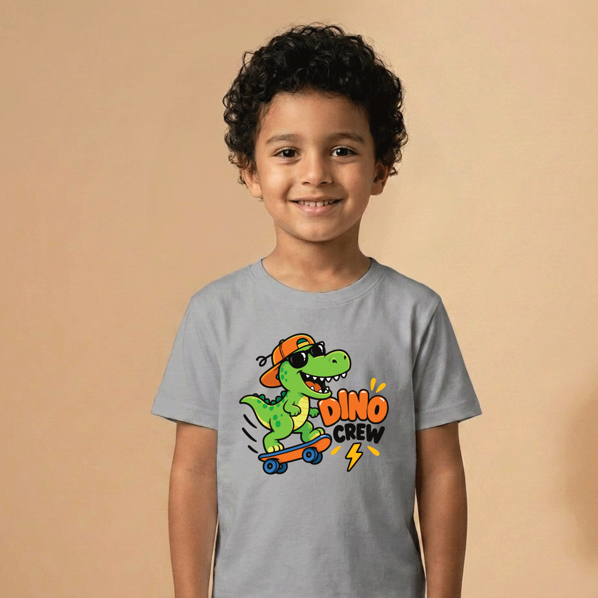Boy modeling the Dino Crew dinosaur skateboard kids T-shirt
